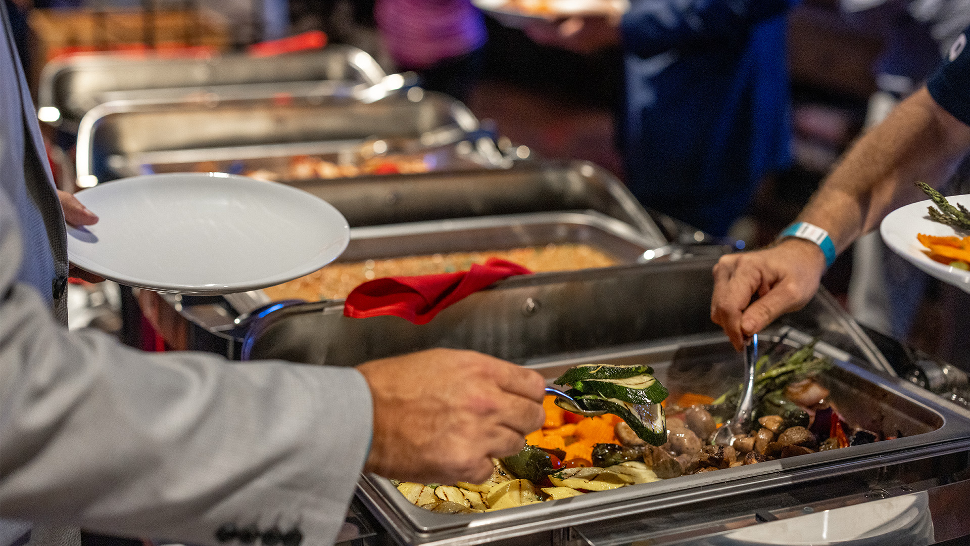 Guests going through buffet line.