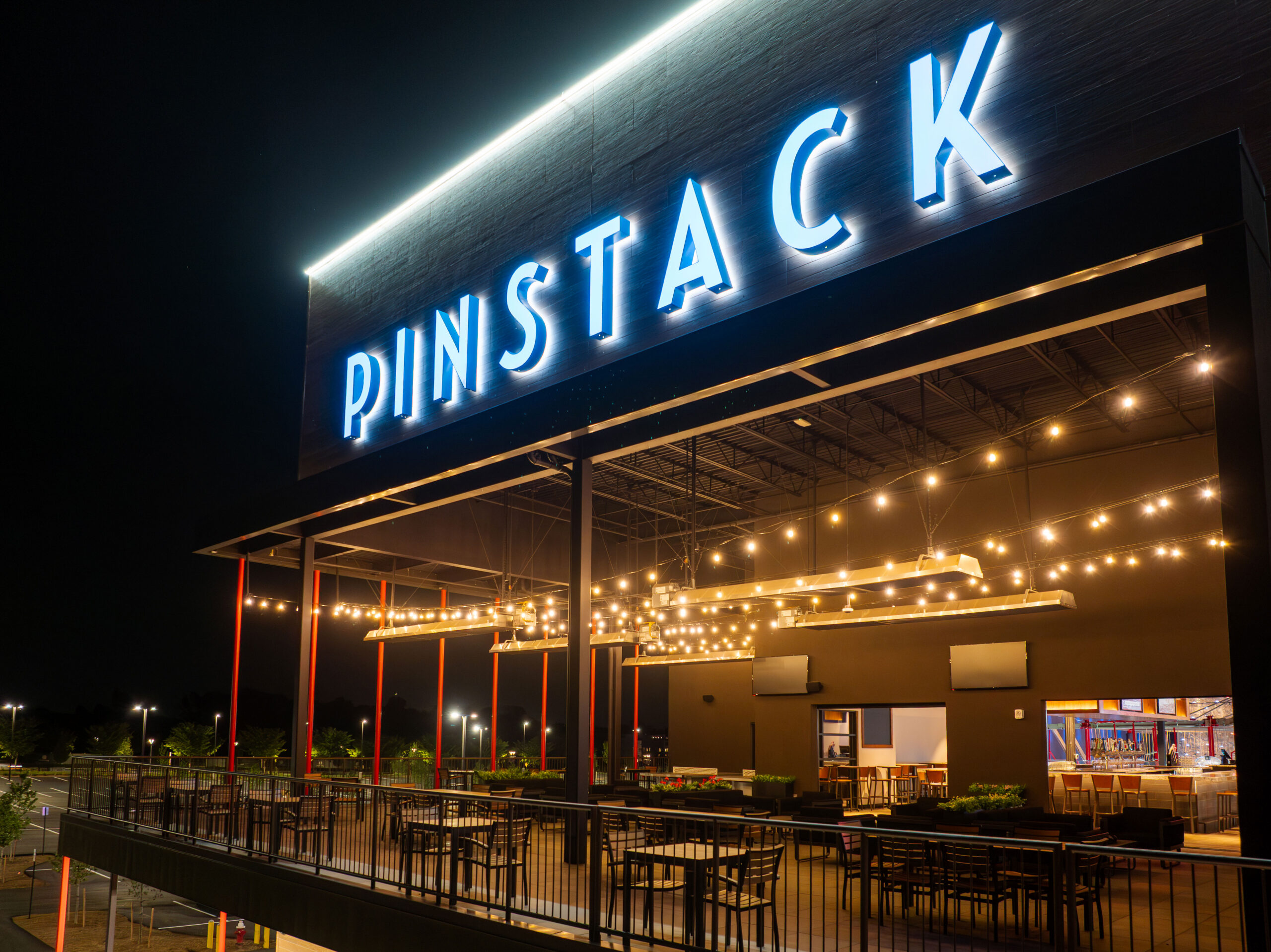 Image of PINSTACK Kincora exterior at night.